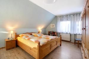 Postel nebo postele na pokoji v ubytování Ferienwohnung Nordmeer