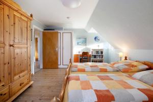 Postel nebo postele na pokoji v ubytování Ferienwohnung Nordmeer