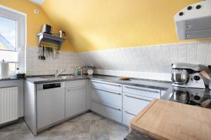 Kuchyň nebo kuchyňský kout v ubytování Ferienwohnung Nordmeer