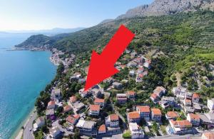 an aerial view of a town next to the ocean at Prestige Apartments in Jesenice