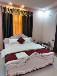 Postel nebo postele na pokoji v ubytování Shree Nanda Guest House