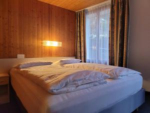 Voodi või voodid majutusasutuse Dinh Residence toas