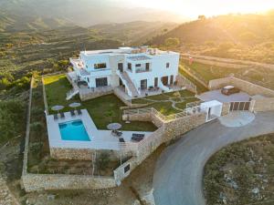 an aerial view of a house with a swimming pool at Villa d'Anvers - Luxury Holiday Resort in Souda