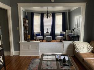 a living room with a couch and a table at Perfect for Families and Traveling Professionals in Albany