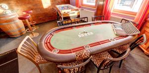 a dining room with a pool table in the middle at Das Mountain Getaway - Exclusive Mega Chalet Stubai Super Card in Fulpmes