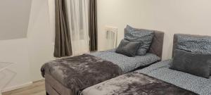 Кровать или кровати в номере Tim's Guesthouse