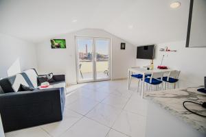 a living room with a couch and a table at Apartments Rosana in Umag
