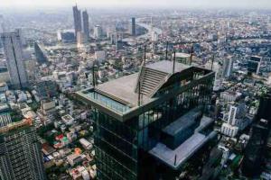 a tall building with a view of a city at MIQ_5br/Silom Bts,Mrt/Wifi 1000MB/Jacuzzi/16pax in Bangkok