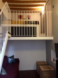 a room with a loft bed and a staircase at ITD unione in Milan