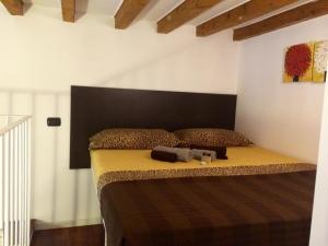 a bedroom with a large bed with a black headboard at ITD unione in Milan