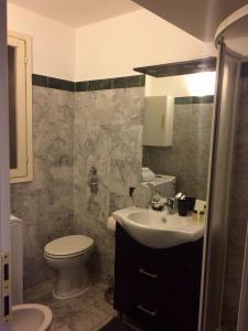 a bathroom with a toilet and a sink and a toilet at ITD unione in Milan