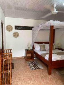a bedroom with a bunk bed in a room at Cynthia’s Homestays@0723632635 in Malindi