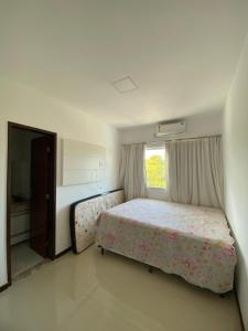 Postel nebo postele na pokoji v ubytování Casa Recanto de Guarajuba + 3 fotografie