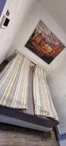 Tempat tidur dalam kamar di Ferienwohnung Sigmarino