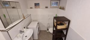 a small bathroom with a toilet and a sink at Ferienwohnung Sigmarino in Sigmaringen