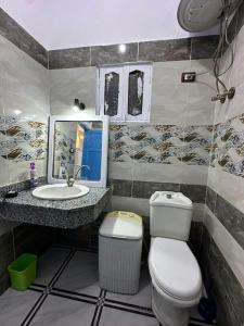 a bathroom with a toilet and a sink at Fresh studio in Dahab in Dahab