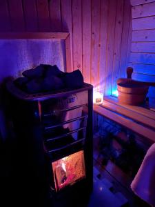 a stove in a room with aperature at Pensiunea PORTAS RESORT in Slănic +98 photos