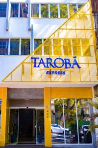 a sign on the front of a hotel at Tarobá Express in Foz do Iguaçu