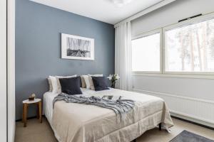 Ένα ή περισσότερα κρεβάτια σε δωμάτιο στο Guest Apartment Saarijärvi, Ilmainen Parkki