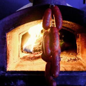 two sausages hooked up to a brick oven at The Anderson in Fortrose
