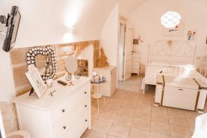 a room with a white dresser and a bedroom at Karen House B&B in Polignano a Mare +49 photos