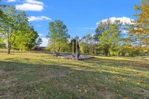 a park with a playground in the middle of a field at The Luxe/Hot Tub/ Putt Putt/10 Mins Shaker Village in Harrodsburg