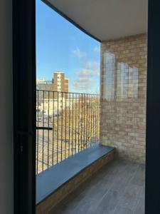 a balcony with a view of a city at Spacious 2BR with balcony in Brentwood in Brentwood