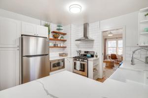 a kitchen with a stainless steel refrigerator and a sink at Centrally Located Reno House Less Than 1 Mi to Midtown in Reno