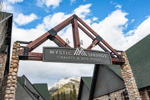 a sign for mystic mtn springs chickens and hot foods at Grotto Canyon Chalet in Canmore