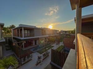 an aerial view of a house with the sunset at Villa Sapê 9 in São Miguel dos Milagres