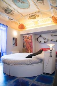 Postel nebo postele na pokoji v ubytování Suite D'Autore Art Design Gallery