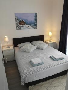 Posteľ alebo postele v izbe v ubytovaní Apartmani Eden Vrsi Mulo