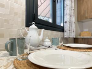 a table with a white plate and a glass at Villabellosa in Villar de Plasencia +23 photos
