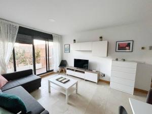 Posezení v ubytování Beautiful modern flat with pool in Lomas de Campoamor