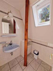 Koupelna v ubytování Balaton Apartman Füred + 37 fotografií
