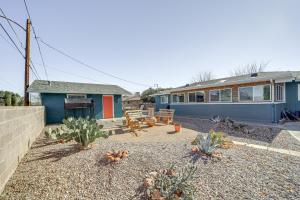 a backyard with a house and a yard with cactus at Artsy Cottonwood Stay with Hot Tub, Walk to Wineries in Cottonwood