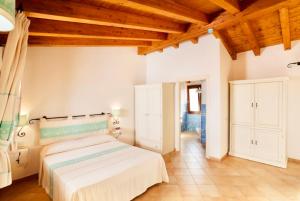 Ein Bett oder Betten in einem Zimmer der Unterkunft Residence with swimming-pool in Vignola Mare
