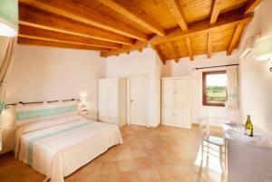 Ein Bett oder Betten in einem Zimmer der Unterkunft Residence with swimming-pool in Vignola Mare