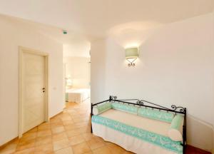 Ein Bett oder Betten in einem Zimmer der Unterkunft Residence with swimming-pool in Vignola Mare