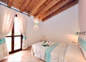 Ein Bett oder Betten in einem Zimmer der Unterkunft Residence with swimming-pool in Vignola Mare