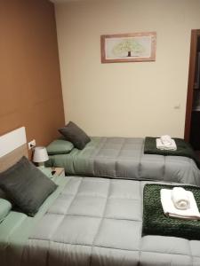 เตียงในห้องที่ Hotel Rural Mirador de Solana