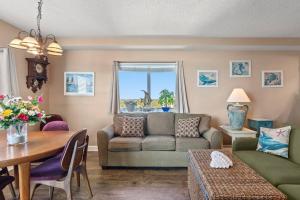 a living room with a couch and a table at Oceanfront Get Away in Myrtle Beach