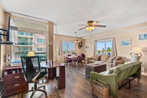 a living room with a couch and a table at Oceanfront Get Away in Myrtle Beach