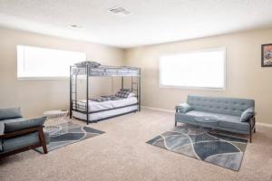 a living room with a couch and a bunk bed at Pool 4 bedroom 2 bath close to Strip in Las Vegas