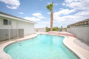 a swimming pool in the backyard of a house at Pool 4 bedroom 2 bath close to Strip in Las Vegas