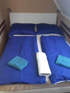Posteľ alebo postele v izbe v ubytovaní Bajnok Apartman