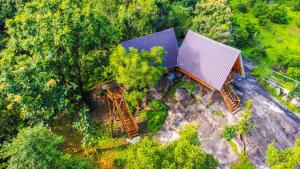 an overhead view of a house in the forest at Sigiri Choona Lodge 'unique sunrise viewpoint' in Sigiriya