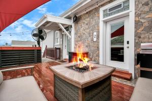 a fire pit on the patio of a house at Nautical Loft with Outdoor Kitchen & Beach Access in Galveston