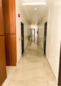 a hallway of an office building with a long corridor at ADDRESS HOTELS AND TOWERS MAITAMA in Abuja