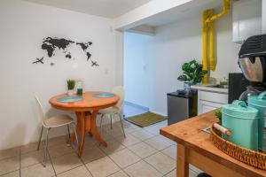 a kitchen with a wooden table and chairs in a kitchen at San Francisco Apartment about 5 Mi to Downtown! in San Francisco